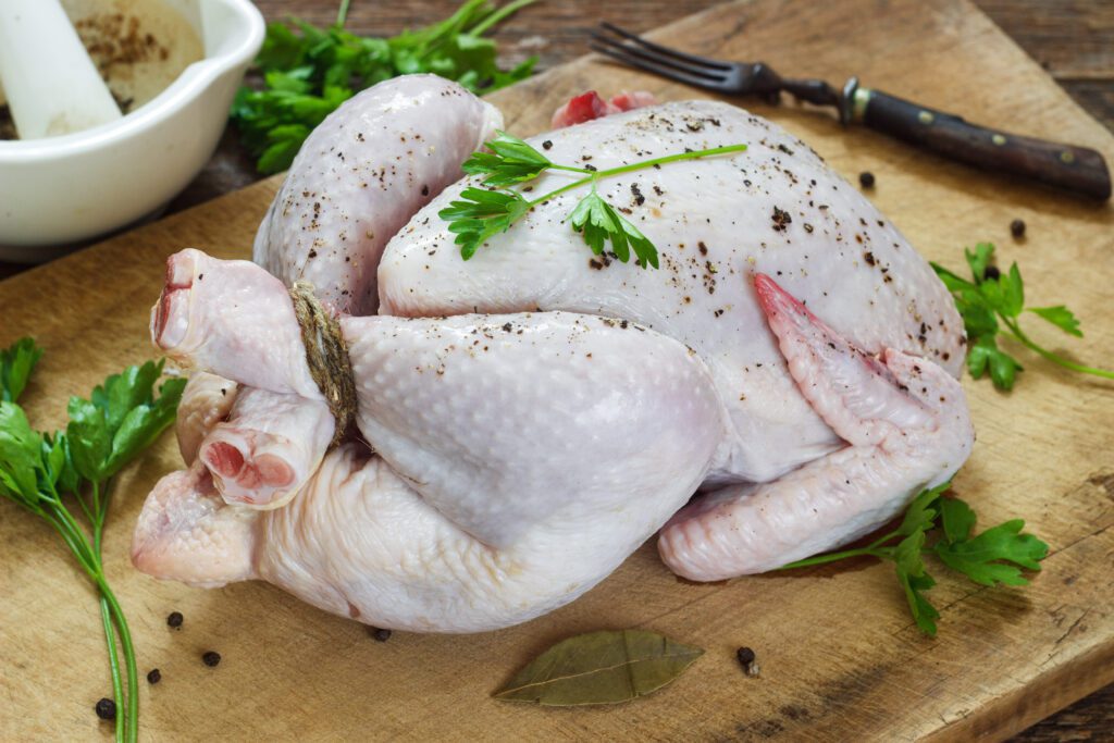Raw chicken on a cutting board